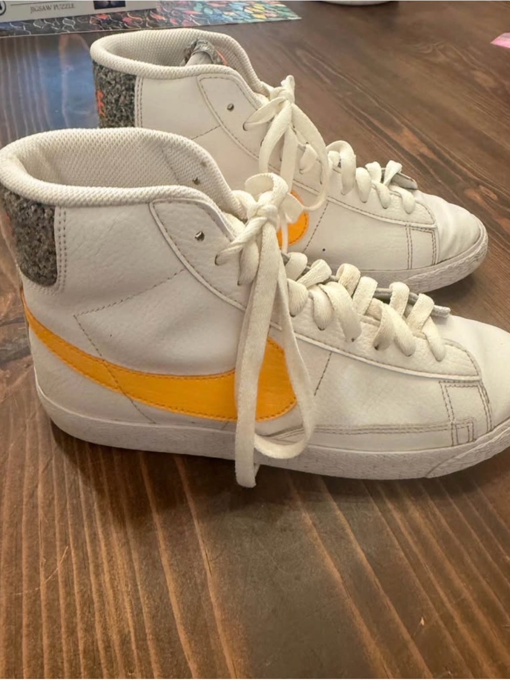 Nike White High-Top Sneakers with Yellow Swoosh